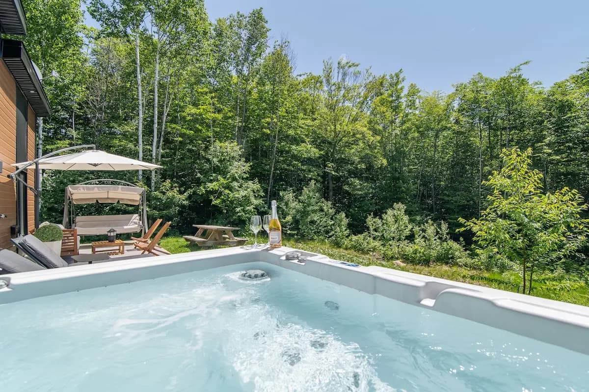 Hot tub with forest backdrop
